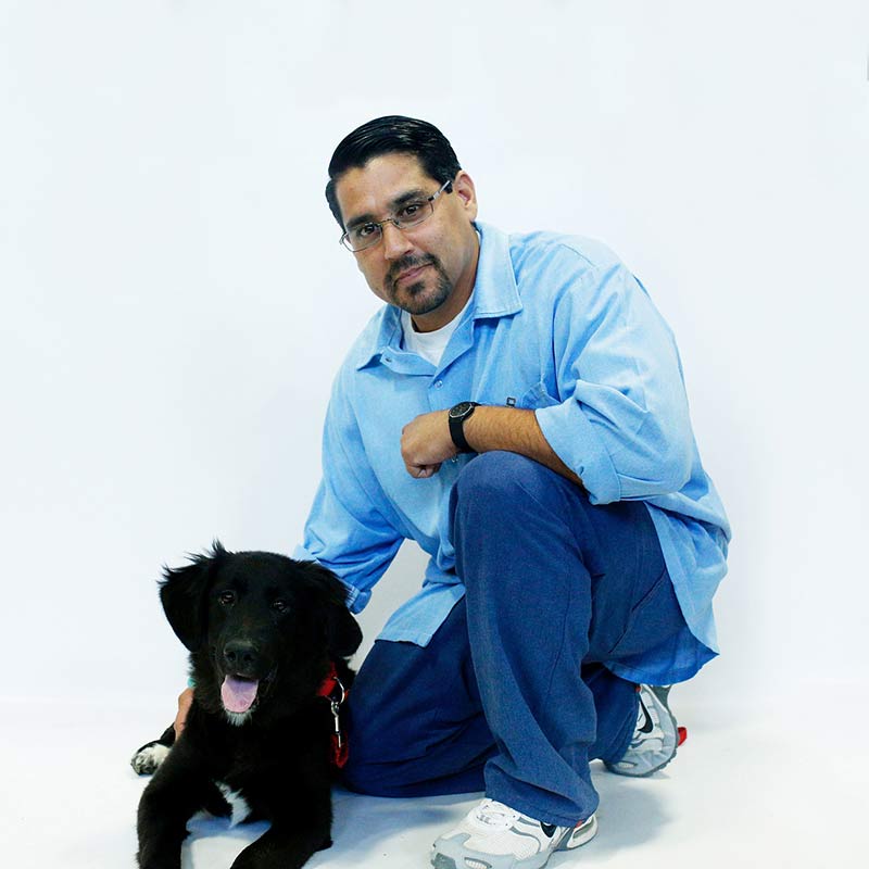 Black puppy and trainer Jesse